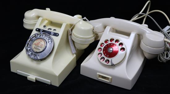 Two white Bakelite telephones